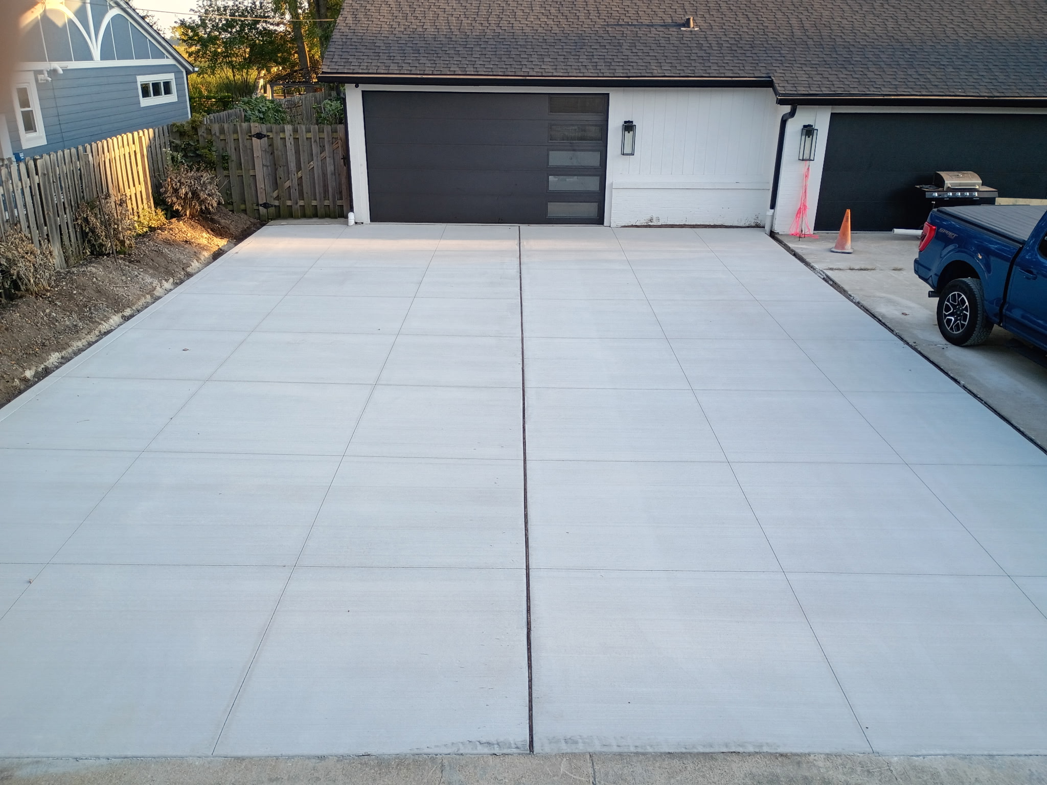 Concrete driveway replacement by Mitten Made Concrete