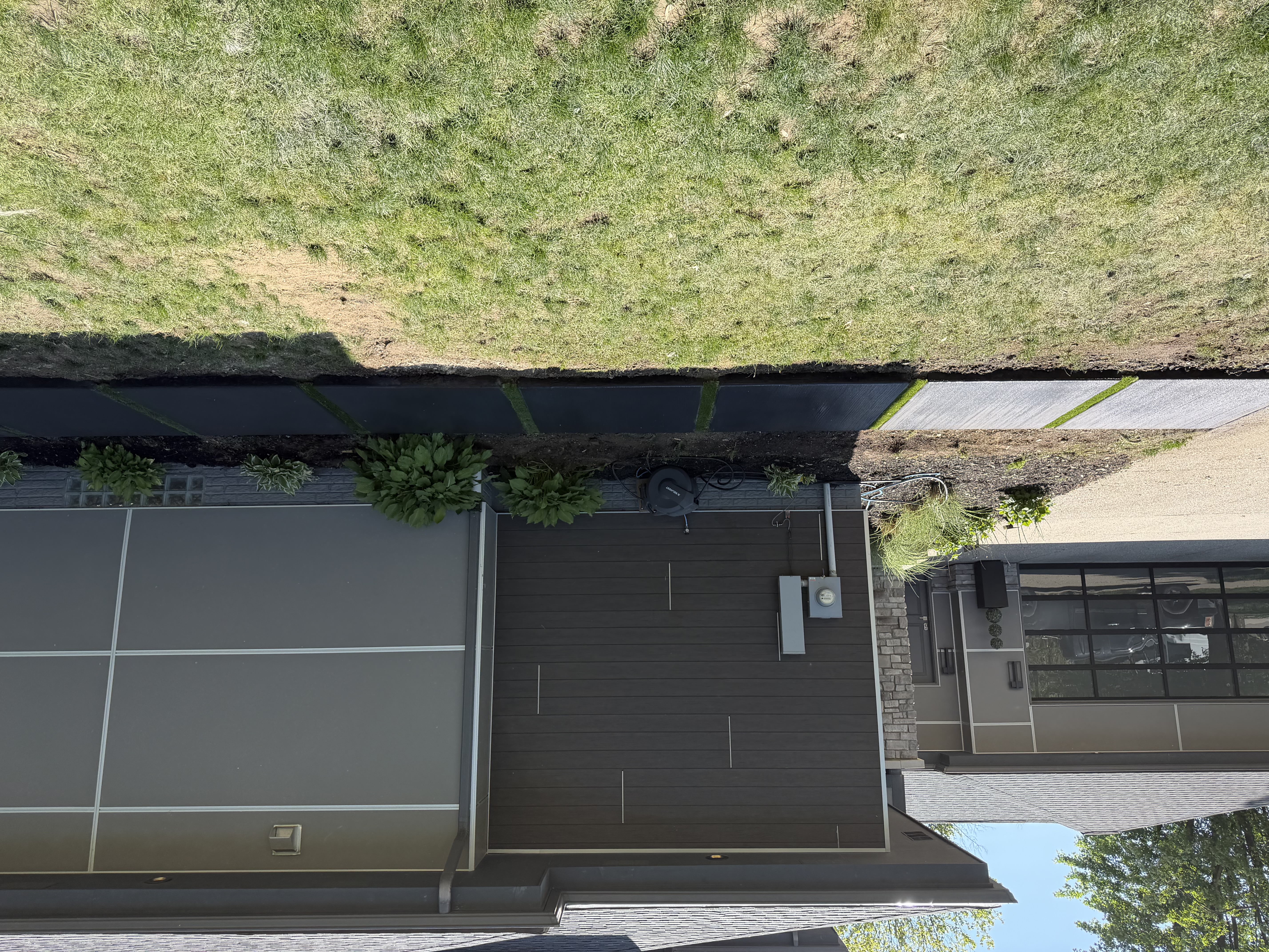 Black colored concrete pads with turf in Troy